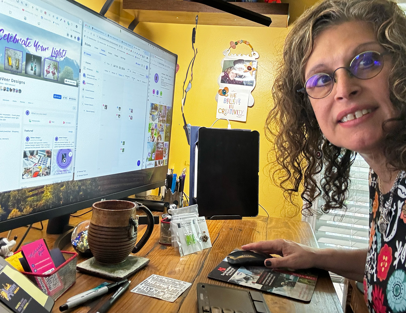 Picture of Nanette at her desk doing social media